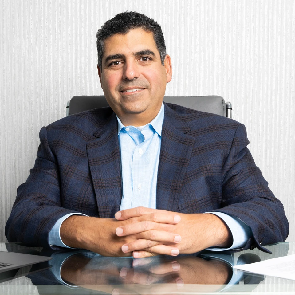 Portrait of Chris Manios MD at his desk